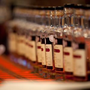 Bottles lined up on a checkered cloth